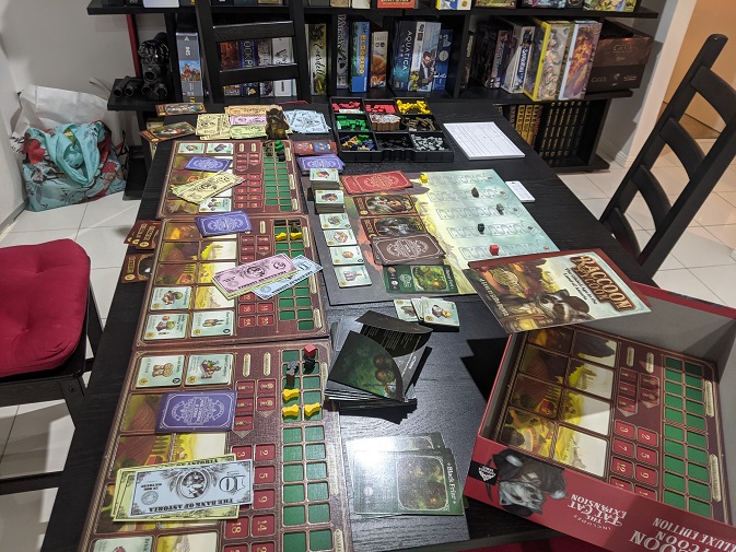 The three player setup of Raccoon Tycoon, almost takes up my whole table.