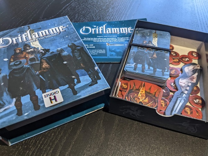 The inside and outside of Oriflamme's box, with all components inside.