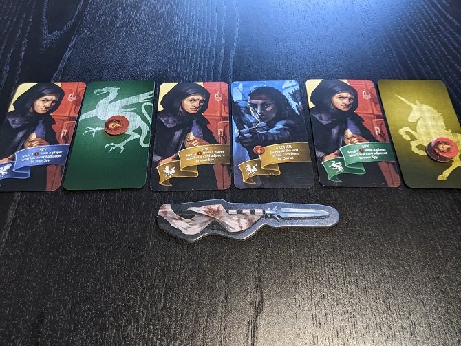 The line of cards, showing three thieves from different houses, an archer, and two face down cards.