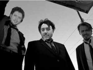 interviewer and interviewee faces badly photoshopped on top of the characters from the movie reservoir dogs