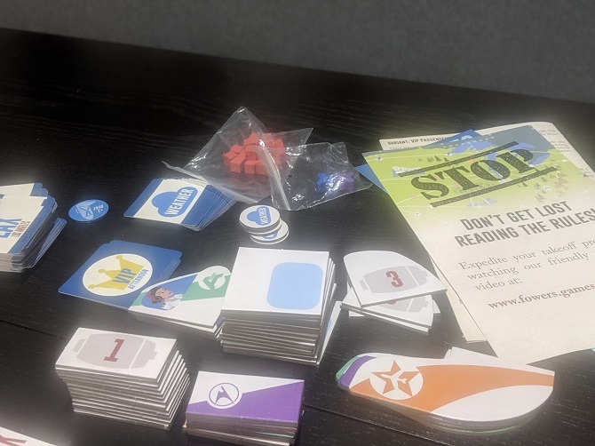 All the components, tiles upon tiles, a couple of cubes and a rule book.