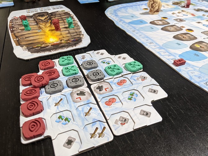 Shows the megalith and the plastic stones you place upon it. Each symbol you cover with a stone, you get those resources.