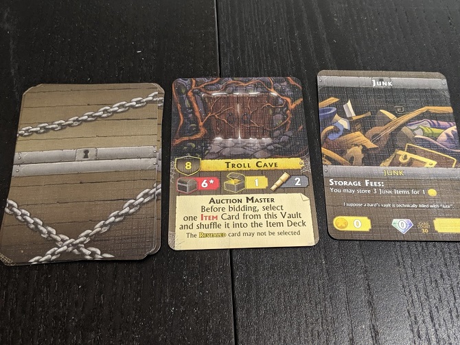 What a vault in play looks like. A pile of cards, next to a vault card, next to a face up Junk card.