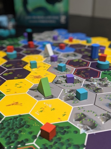Portrait up close shot of the cubes and tents set up from the game.