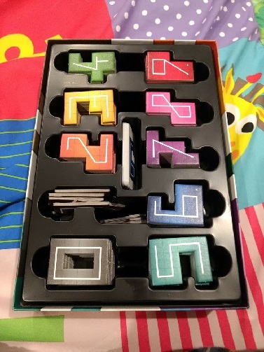 NMBR 9 all packed away. The insert holds a space for each number, and cards in the middle.