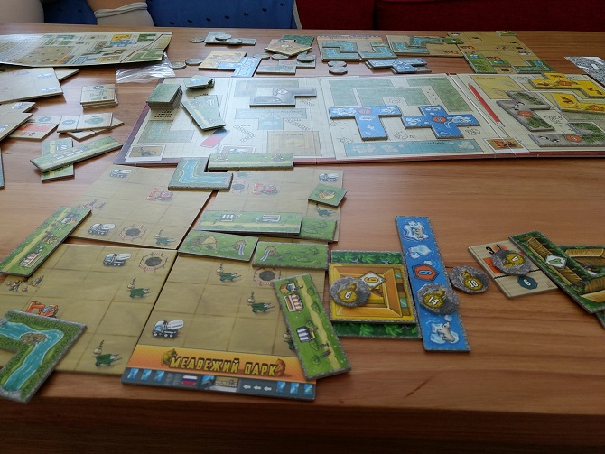 Components of Barenpark half set up, half thrown across the table.