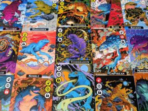 A grid of cards featuring psychedelic illustrations of cosmic frogs. Each card has a unique name and colourful artwork, with small icons on the left side representing various abilities and power levels.